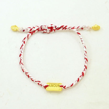 Hand-woven red and pink love thread bracelet featuring an adjustable sliding knot and gold AMOUR charm