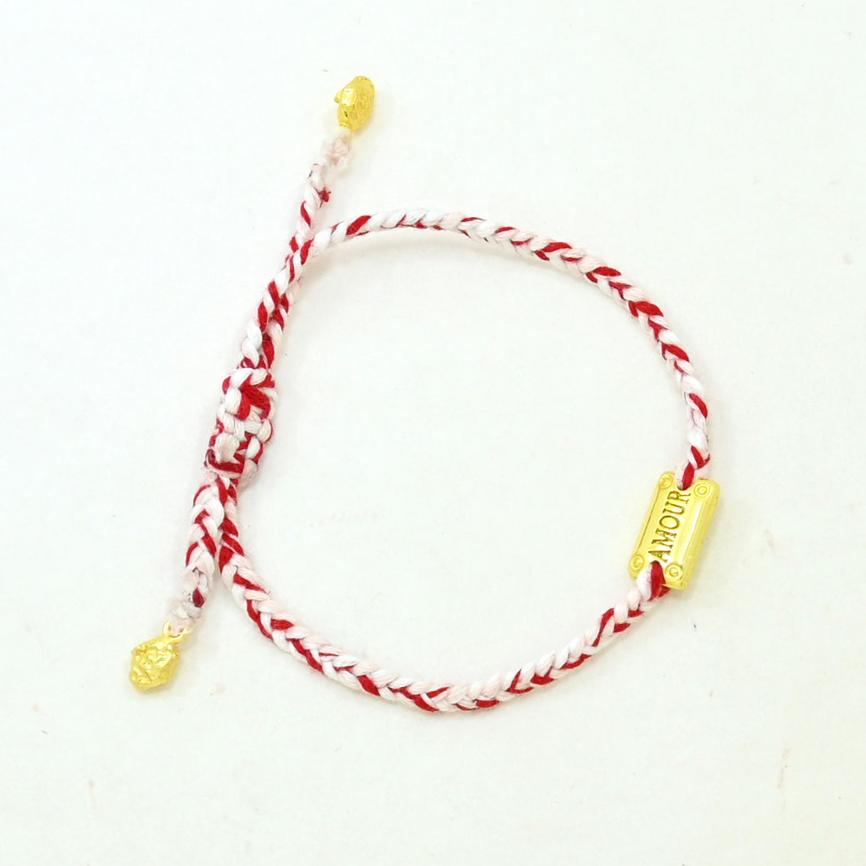 hand-braided AMOUR gold tag cord bracelet