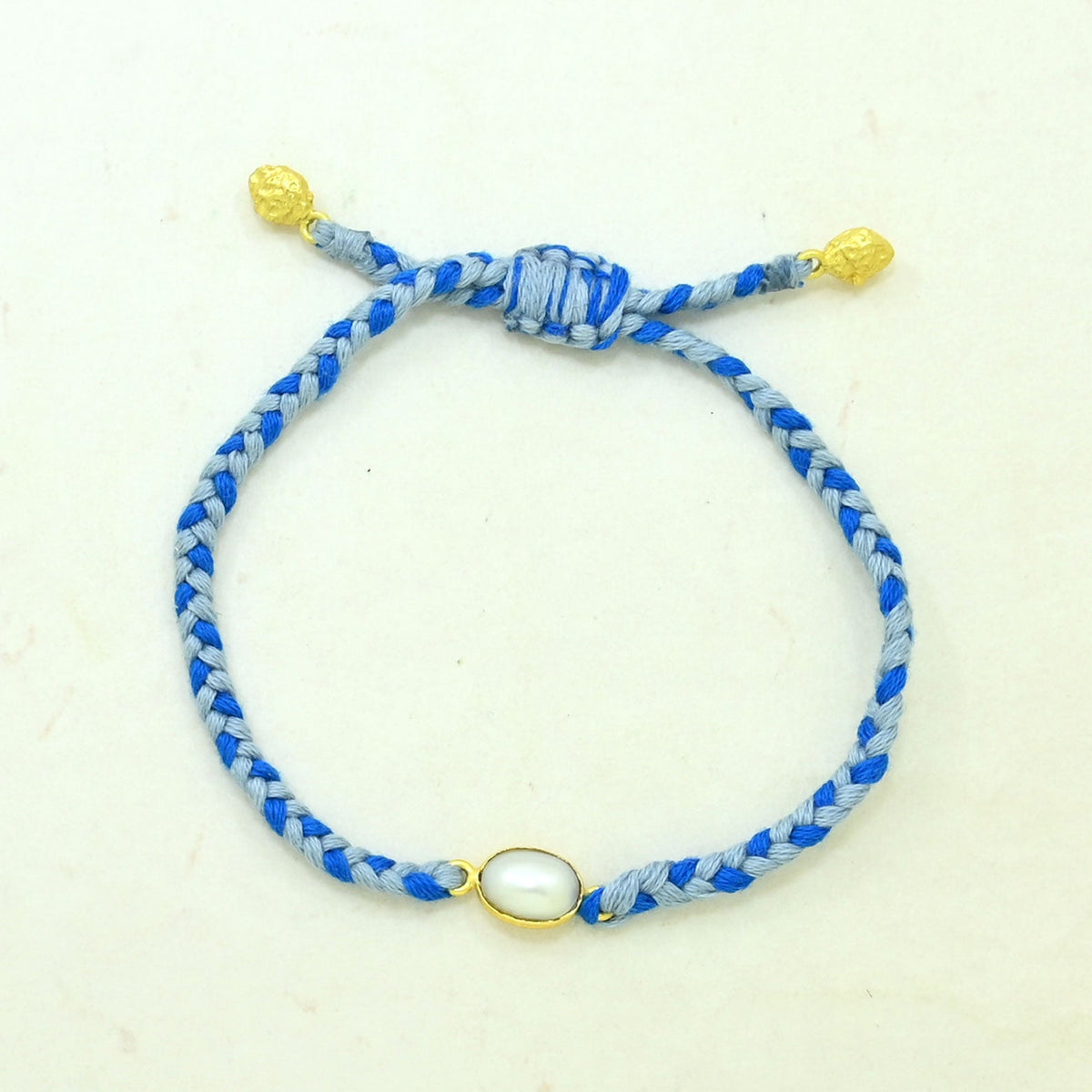 pearl blue braided bracelet gold plated