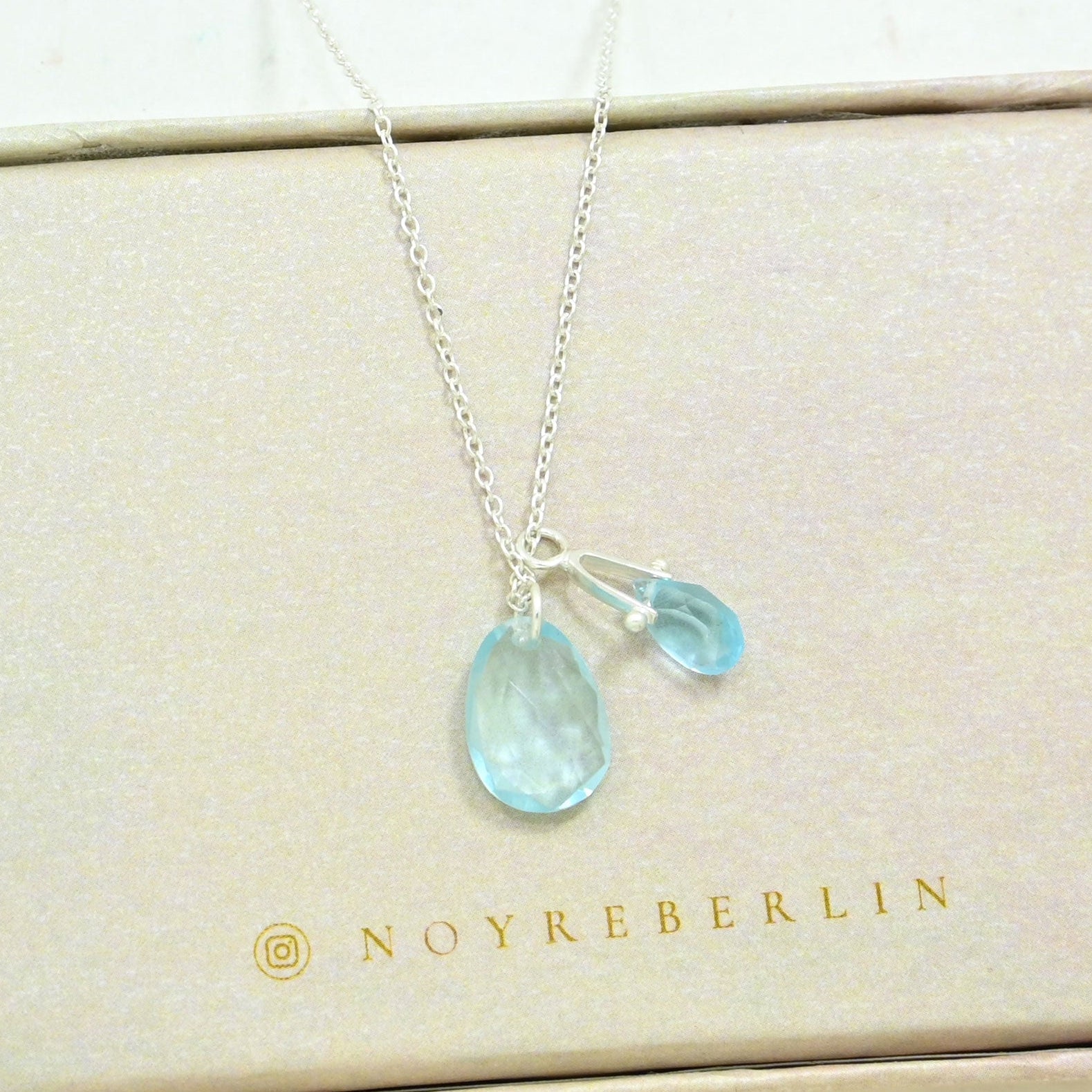 Silver necklace with Blue Topaz gemstone pendant